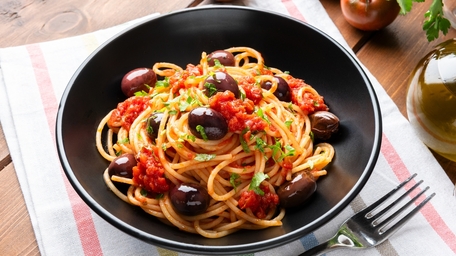 Pasta Puttanesca with beans and basil