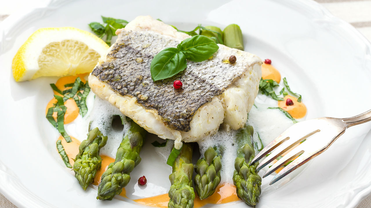 Pan Roasted Hake Fillet  with Connemara Clams, Peas and Poached Oysters 