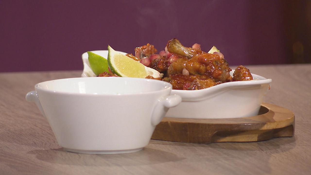 Chipotle Spiced Chicken Wings with Crozier Blue Cheese Crème Fraiche, Pomegranate and Lime