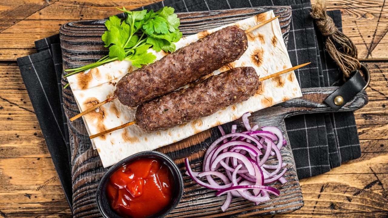 BBQ Lamb Koftas, Flat Breads, Garlic Mayo and Tomato Salad