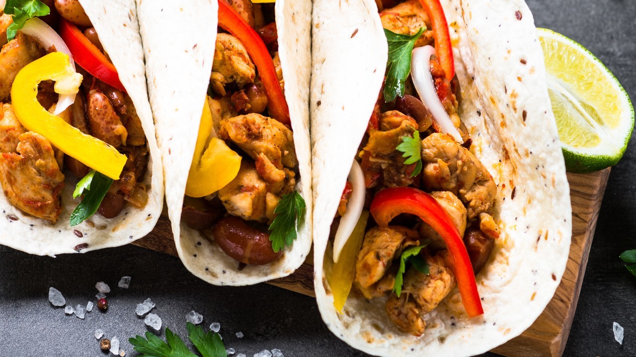 Sticky Cajun Chicken Tacos with Ranch Dressing, Guacamole, Pico de Gallo, Radish & Corn