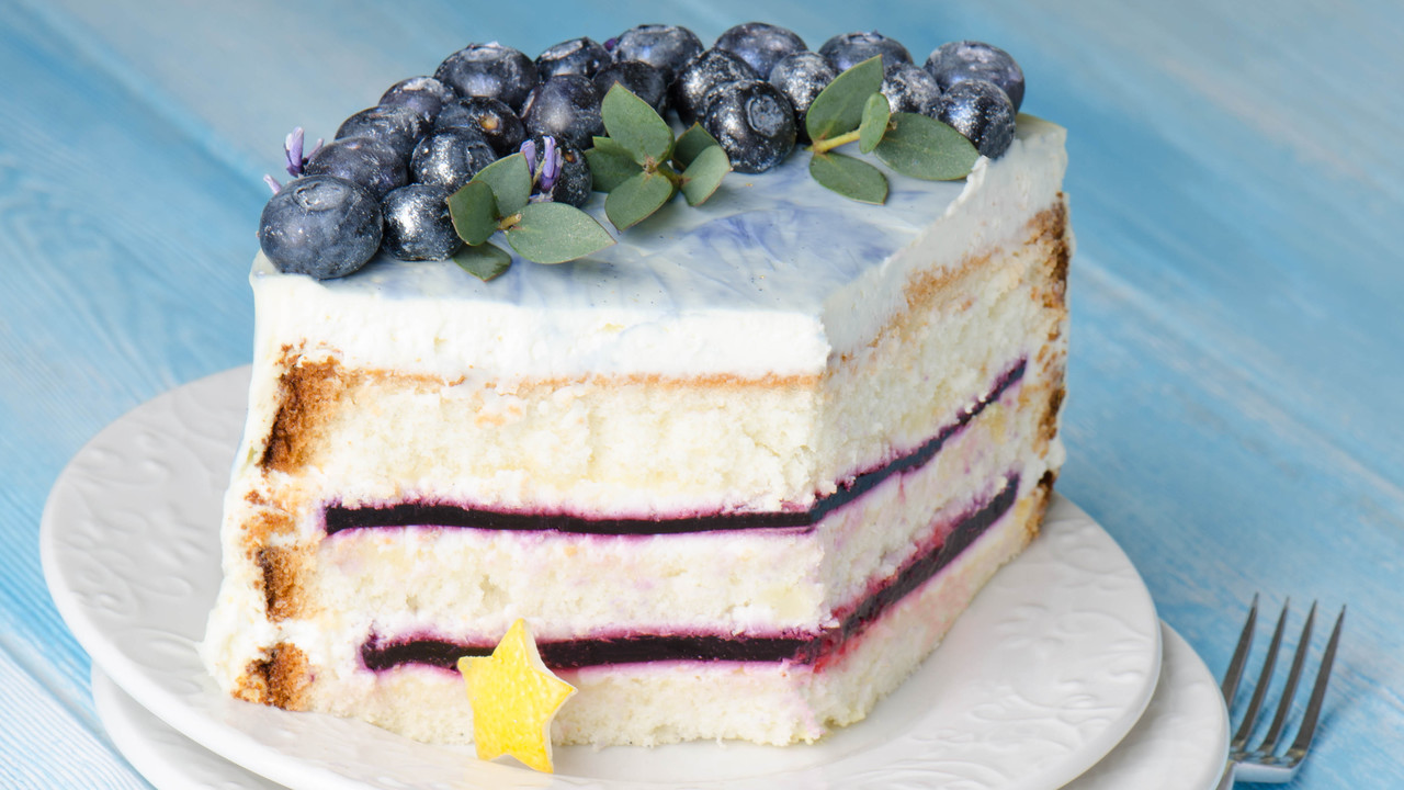 Lemon and blackcurrant Cake Decorated with Edible Flowers