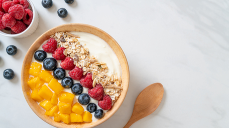 Poached Mango and Raspberries, with Citrus Cream, and Granola