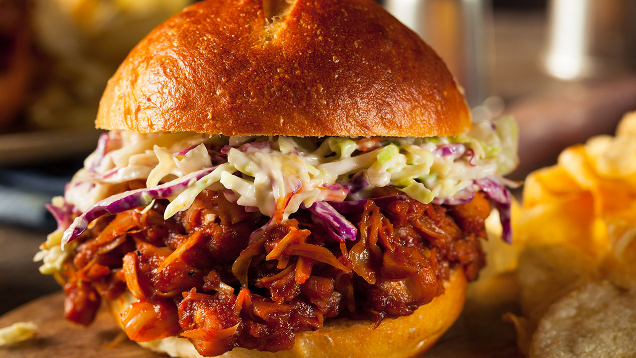 Vegan pulled jackfruit sandwich with an creamy garlic, pea and mint slaw.