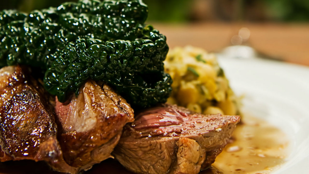 Joes Irish lamb rump with minted champ, braised red cabbage and redcurrant jus
