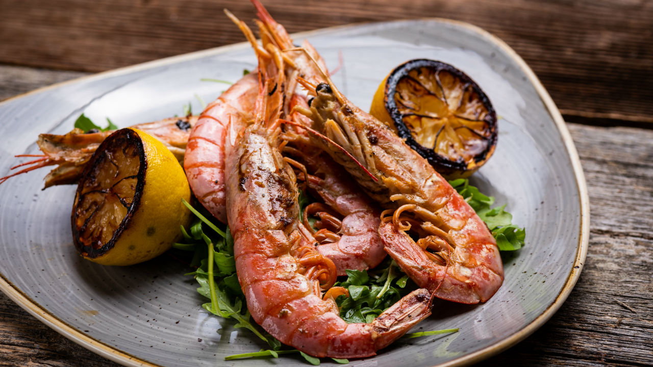 Chermoula king prawns, lime yoghurt with blood orange, fennel, rocket salad